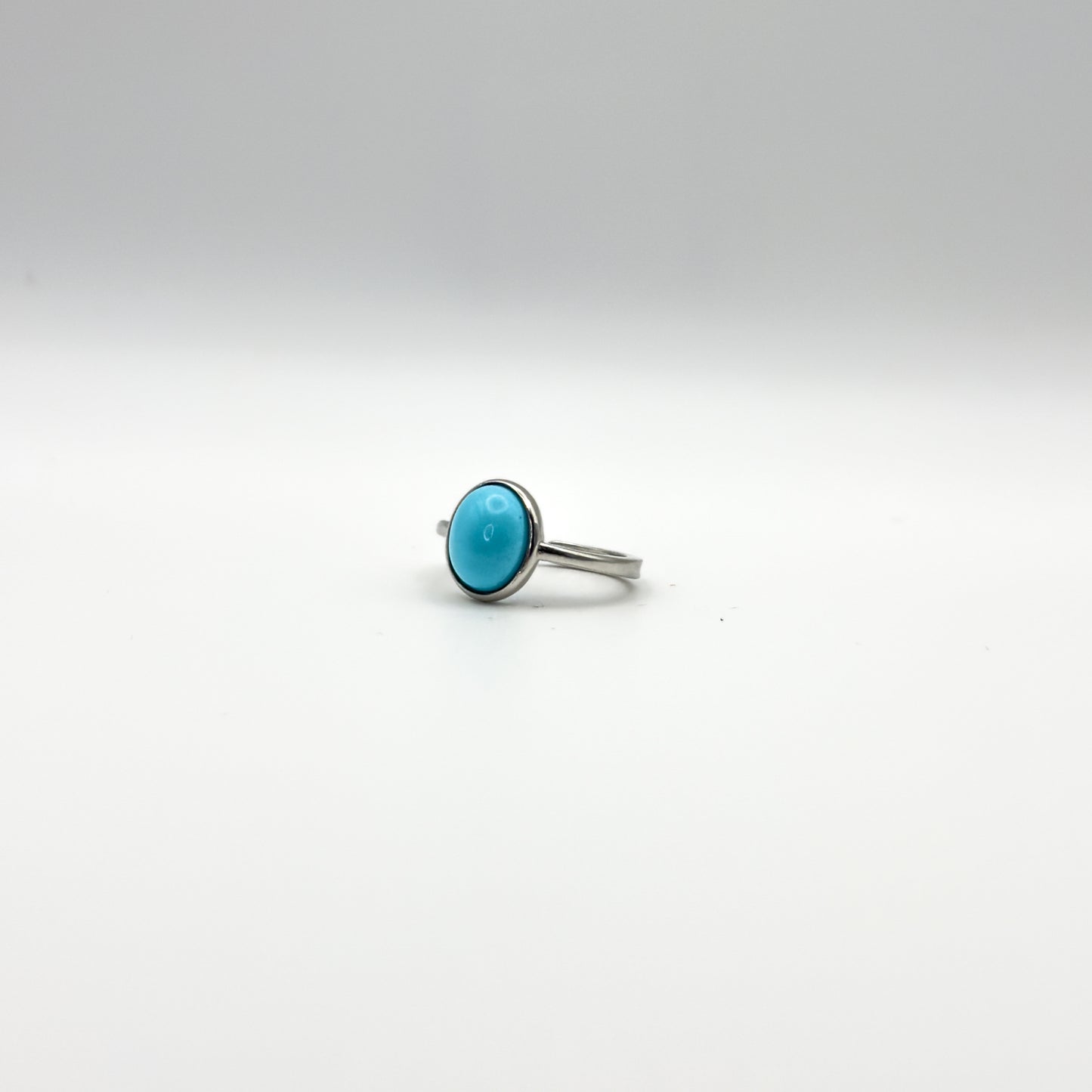 ANELLO CON CABOCHON TURCHESE OVALE IN ARGENTO 925 RODIATO - REGOLABILE