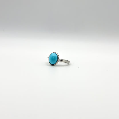 ANELLO CON CABOCHON TURCHESE OVALE IN ARGENTO 925 RODIATO - REGOLABILE